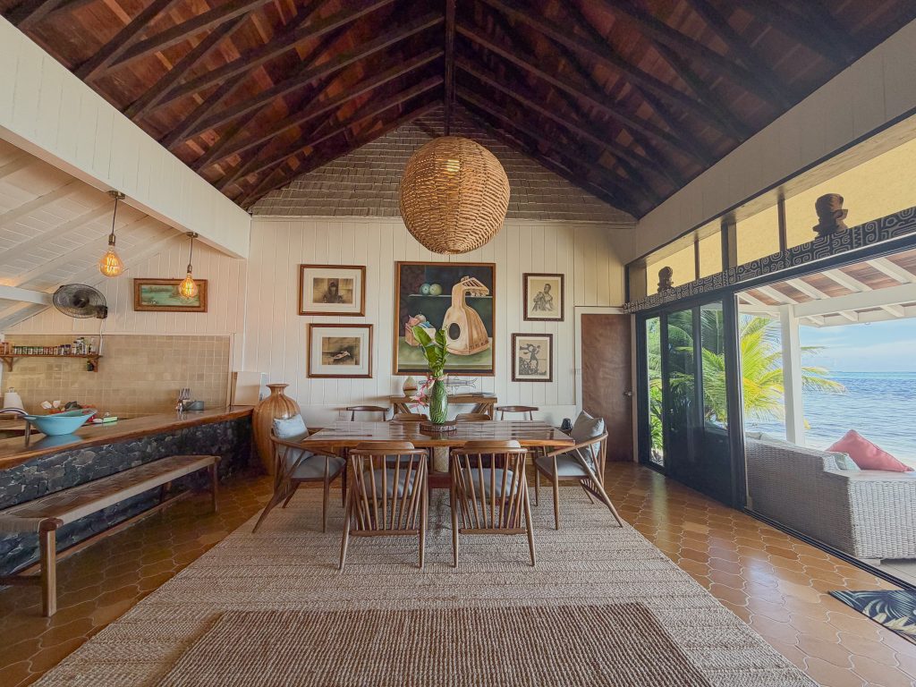 Dining area with vaulted wood ceiling and lagoon views in Moorea